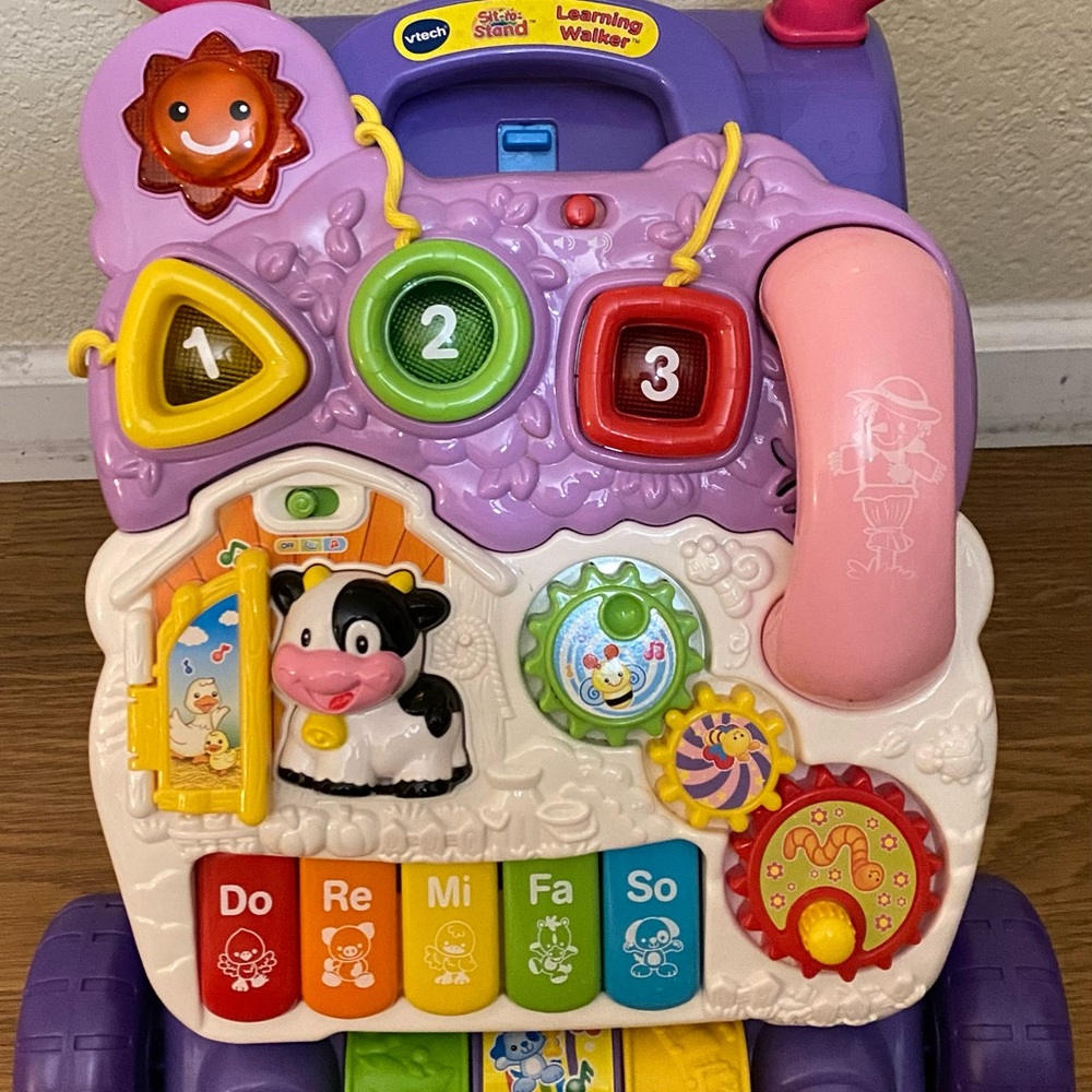 VTech learning walker. Sit to stand for baby girls.